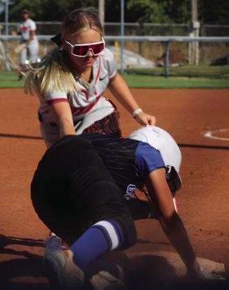 Brylan Shephard slides into thrid base safely.