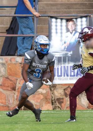 Guthrie’s Amare Watson looks for running room against Blanchard on Sept. 19. Bluejays won 48-7.