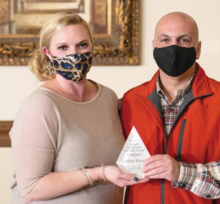 Chamber CEO and President Brittany Timmons and John Pagonis of Guthrie Haunts Small Business of Year.