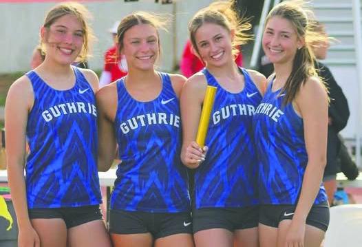 Guthrie’s 4x100 relay team of Oliviah Bryan, Jackie Howell, Cora Leach and Madi Brooks sprints to a school-record time of 48.82 at Edmond Memorial. Photo courtesy of Guthrie Highschool XC/Track Facebook page.