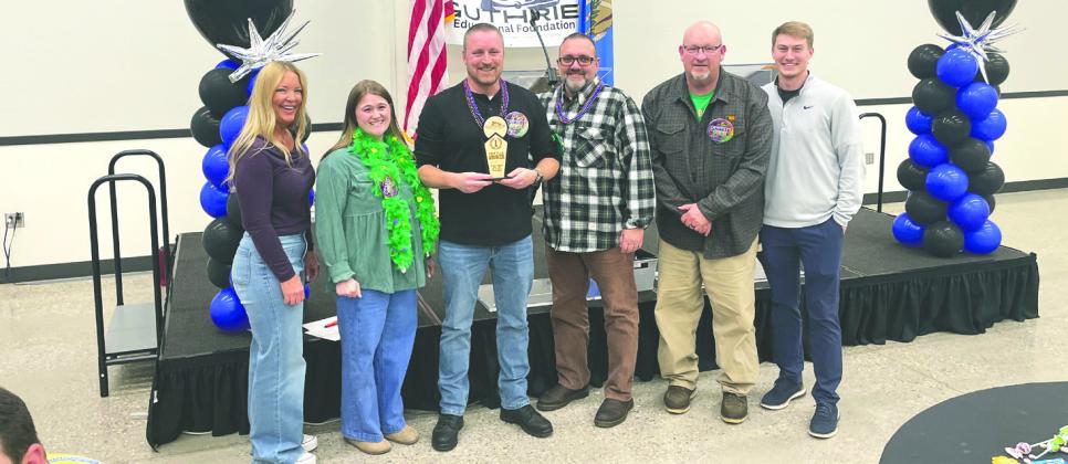 Guthrie Junior High teachers celebrate after winning the GPS trivia fundraiser with their “Smarty Gras” theme, The team claimed top honors during the fiercely competitive and fun-filled evening benefiting GPS classroom grants. Photo Nikki Bos