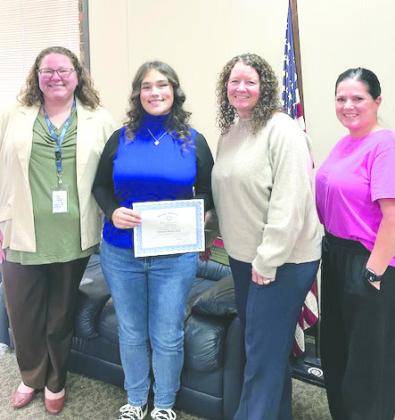 Pictured with Nikole is Ashley Garner with CASA for Kids, Rotarian Kristal Flury and Keri Scheihing with CASA for Kids.