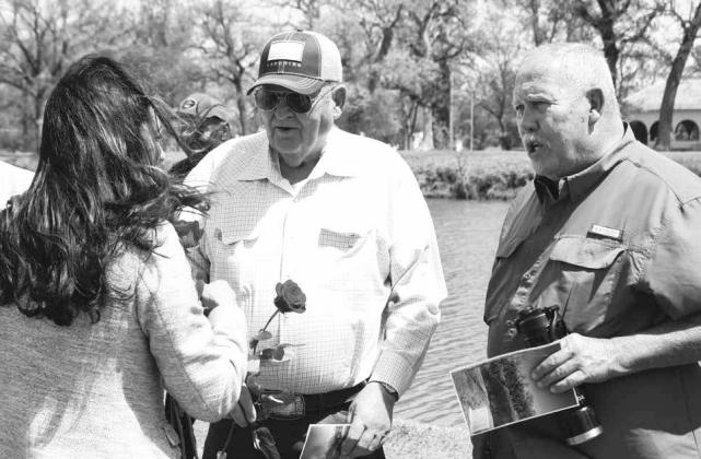 U.S. Rep. Stephanie Bice distributes roses in honor of victims at a memorial for the Murrah Building bombing. Photo courtesy of City of Guthrie.