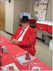 Festive attire adds to the holiday spirit as a senior attends the Logan County Aging Services Christmas dinner Wednesday, Dec. 17, at Highland Hall in Guthrie. Photo by Nikki Bos