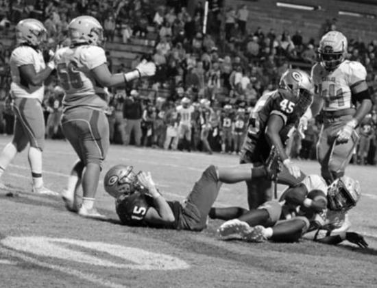 Guthrie’s Chris Shaputis and Landen Hirzel take down Ike running back