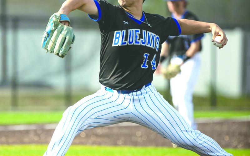 Guthrie’s Hayden Clymer (14) pitches during a high school baseball game against Midwest City on Monday, March 10, 2026, in Midwest City. The game was halted by school administrators because of severe weather with the score tied in the top of the seventh inning. Photo by Brent Fuchs.