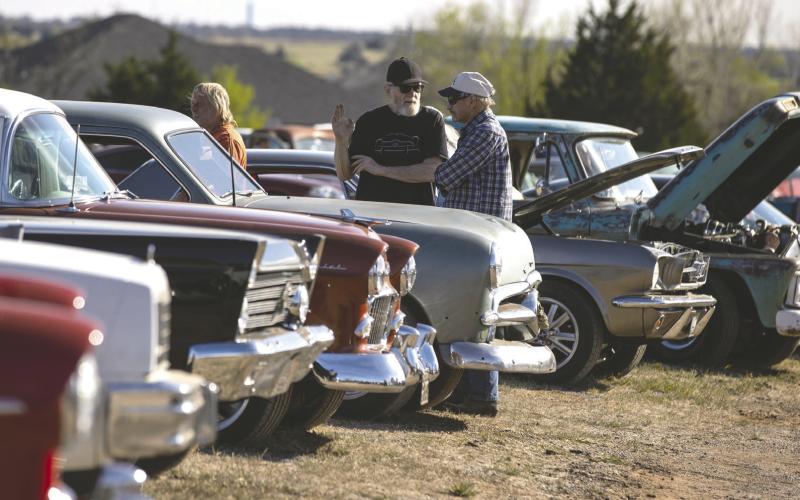 Cars make one final cruise at The Beacon Drive-In Theatre during the Last Lap Car show March 28, in Guthrie, OK. Photo by Brent Fuchs