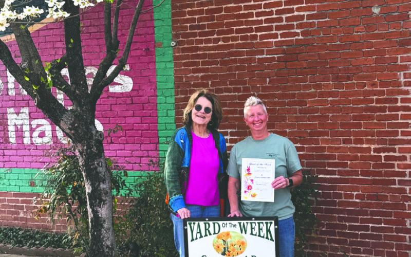 1 Stop Copy Shop is the Jonquil Garden Clubs Yard of the week. Pictured is Jennie Woodard, Jonquil Garden Club and Anna Coffin/DeMars. Submitted photo