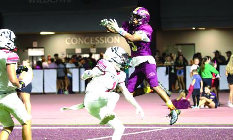 Cashion’s Grayson Davis, who scored a touchdown, hauls in the football in a 42-7 win over Watonga on Friday night.