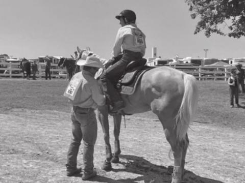 Little Britches Rodeo Finals competitor on horse at Lazy E Arena.