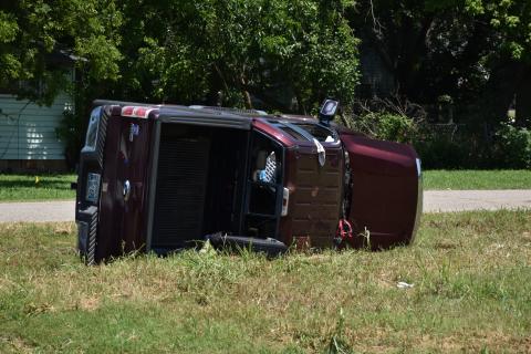 Truck flipped on side at the conclusion of the chase. Picture by Brett Tennyson
