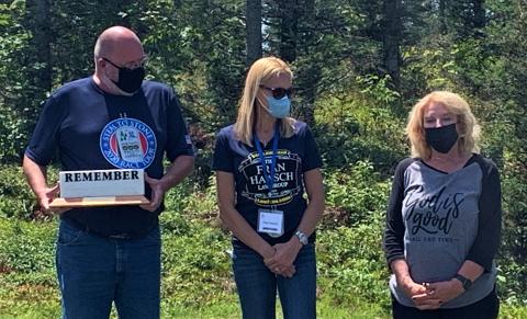 Wreaths Across America Executive Director, Karen Worcester presents The Fran Haasch Law Group with the WAA Remembrance Award. (Photo courtesy of WAA Staff)