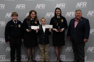 (Left to Right: Jace Taylor, Kaylea Taylor, Fletcher Inman, Baylee Brown with AFR Cooperative President Scott Blubaugh.)