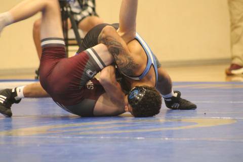 Guthrie's Kaedin Herendeen wrestles with Perry's Tucker Vollmer in Thursday's dual, Thursday, Dec. 5.