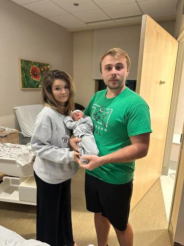 Tessa Dismuke (left) and Justin Nelson with Baby Axton. Photo Courtesy Facebook. 