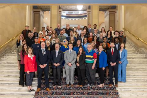 Sen. Chuck Hall, R-Perry, and Rep Collin Duel, R-Guthrie, pose for a photo with city officials, business leaders and residents of Guthrie on the second annual Guthrie Day at the Capitol. 