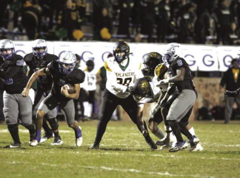 Guthrie's Kolten Carlock breaks away against Lawton MacArthur in the first round of the 2024 Class 5A state playoffs.