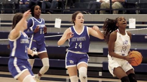 Ania Morgan with Glenpool players in pursuit. Photo by Mike Monahan.