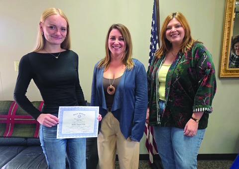 Taylor Mays, Nicole Piersol with Serenity Spa and Rotary President, Coy McPeek.