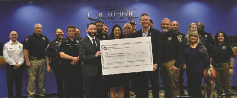 Congresswoman Stephanie Bice with city leaders and law enforcement officers at the check presentation Feb. 17. Photo by Nikki Bos
