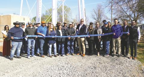 Guthrie community members and officials marked the completion of a new booster pump station at a ribbon cutting ceremony on March 23.