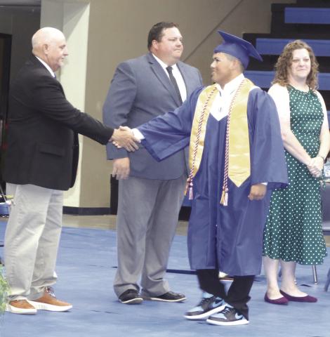 Coyle Graduation-Shane Weathers congraulates Joaquin Amaro.