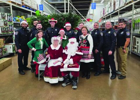 Guthrie Police Officers with Santa and Mrs. Claus at the annual Shop with a Cop event. Photos courtesy Guthrie Police Department.