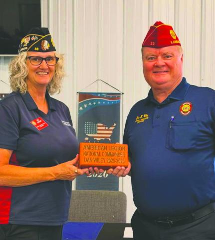 National American Legion Commander Dan Wiley, left, accepts a personalized commemorative brick from Lebron American Legion Post 58 Commander Kim Vincent. The brick was placed in Guthrie’s Honor Park to commemorate Wiley’s service and visit.