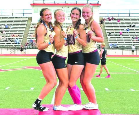 Members of the Cashion High School girls 4x100-meter relay team Kastner, Eubanks, Nabavi and Hobgood celebrate after winning the Class 2A state championship. Photo courtesy of Cashion Public Schools
