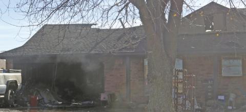 An early Monday morning fire in the 1700 block of Ken Drive caused extensive damage to the house. The fire was called in around 3:30 a.m. and required assistance from Oak Cliff and Sooner Fire Departments. The roof collapsed on the back of the house. The cause of the fire is still under investigation. Photo by Mike Monahan