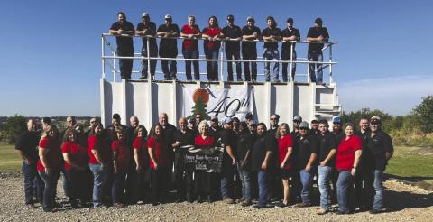 Employees and leadership of Environmental Management Inc. (EMI) gathered in Guthrie in 2023 to celebrate the company’s 40th anniversary. Photo courtesy of EMI.