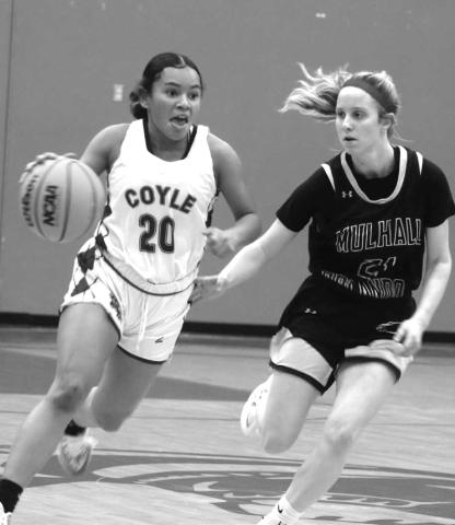 Coyle’s Arianna Vasquez drives around Lady Panthers Emily Parsons.
