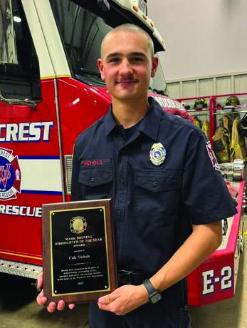 Cole Nichols receives the Mark Bruning Firefighter of the Year Award for 2025. Photo courtesy of Woodcrest Fire Department.