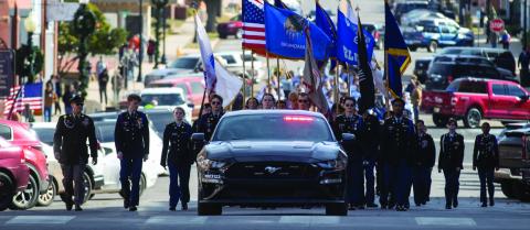 Members of the Guthrie High School JROTC march at the head of the Nov. 11, 2025 Veterans Day parade in Guthrie, Oklahoma, as the community pays tribute to its service members. 