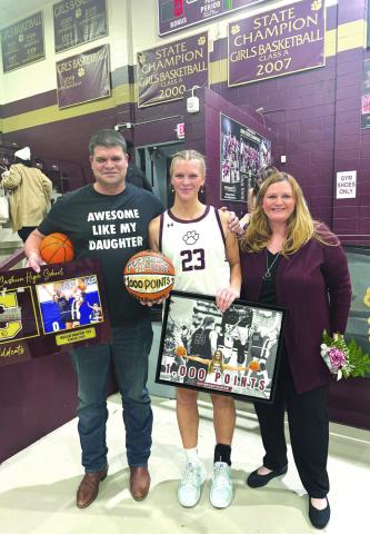 Cashion's Megan Shafer with her family during her 1000 point record hitting game Courtesy of Kim Shafer.