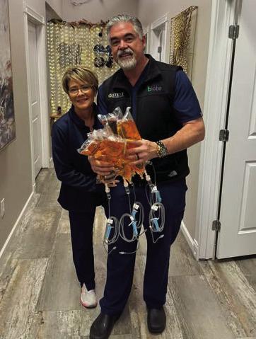 Stephen and Tina Hartzell ready to serve firefighters. Photo courtesy of Strive Wellness, Facebook.