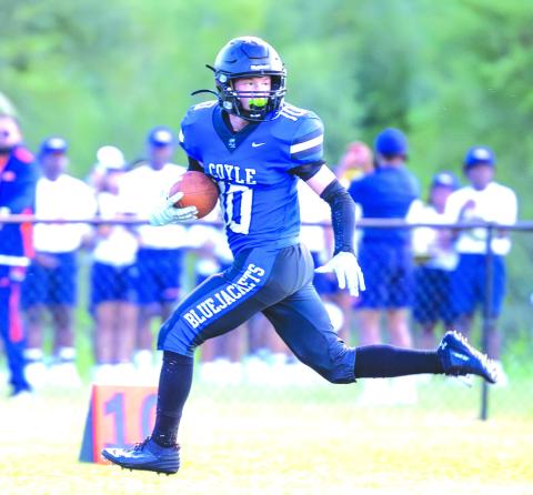 Coyle running back Carson Hock (#10) picks up some of his 225 yards on the ground against Yale on Sept. 5. Hock scored four touchdowns to lead the Bluejackets to a 48-32 win. Photo by Brent Fuchs.
