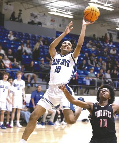 Guthrie’s Jahvari Harper (10) finishes at the rim against Harding Charter onTuesday, Feb. 17, 2026, in Guthrie, Okla. Guthrie won 67-6. Photo by Brent Fuchs.