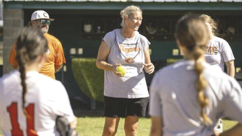 Crescent softball head coach addresses the team during practice as the Tigers prepare for the start of the upcoming season.