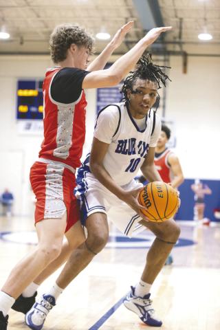 Guthrie’s Jahvari Harper looks to score against a Carl Albert defender during the Blue Jays’ 88-69 loss Feb. 6. 