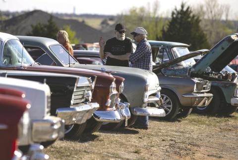 Cars make one final cruise at The Beacon Drive-In Theatre during the Last Lap Car show March 28, in Guthrie, OK. Photo by Brent Fuchs
