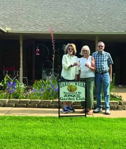 Jonquil Garden Club yard of the week is 410 Lake Road. Pictured is Jennie Woodard, Jonquil Garden Club Member , Jeannette and David Fletcher.
