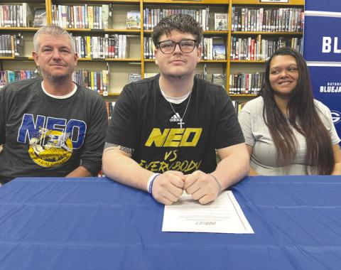 Guthrie High School senior Ethan Gilbert signs his letter of intent to play college football at NEO A&M during a National Signing Day ceremony. Gilbert was a two-year starter on the Bluejays’ offensive line. Photo courtesy of Guthrie News Page.