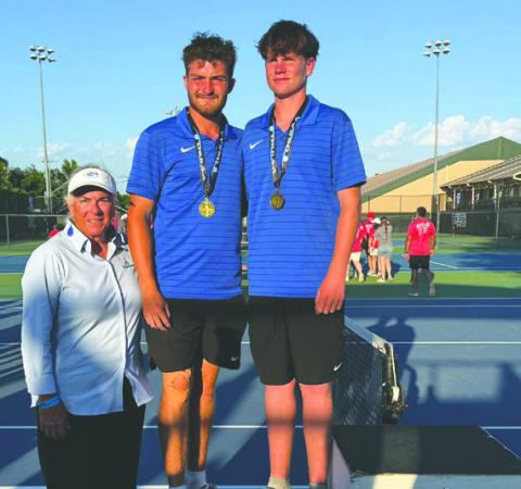 Guthrie’s Carson Olmsted and Jaxson Mayer celebrate a thirdplace finish. Guthrie Tennis