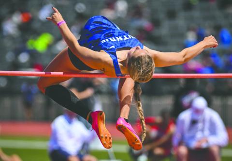 Senior Lily Rechlin clears a record-setting height in the high jump, establishing a new mark for Guthrie during recent competition. Photo courtesy of Guthrie Highschool XC/Track Facebook page.