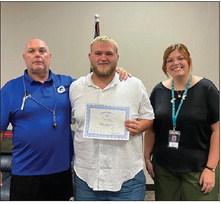 Pictured with Cooper is GHS Football Coach, Kelly Beeby and Rotary President, Coy McPeek.