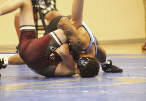 Guthrie's Kaein Herendeen wrestles in the dual against Perry on Dec. 5, 2024. Photo by George McCormick.