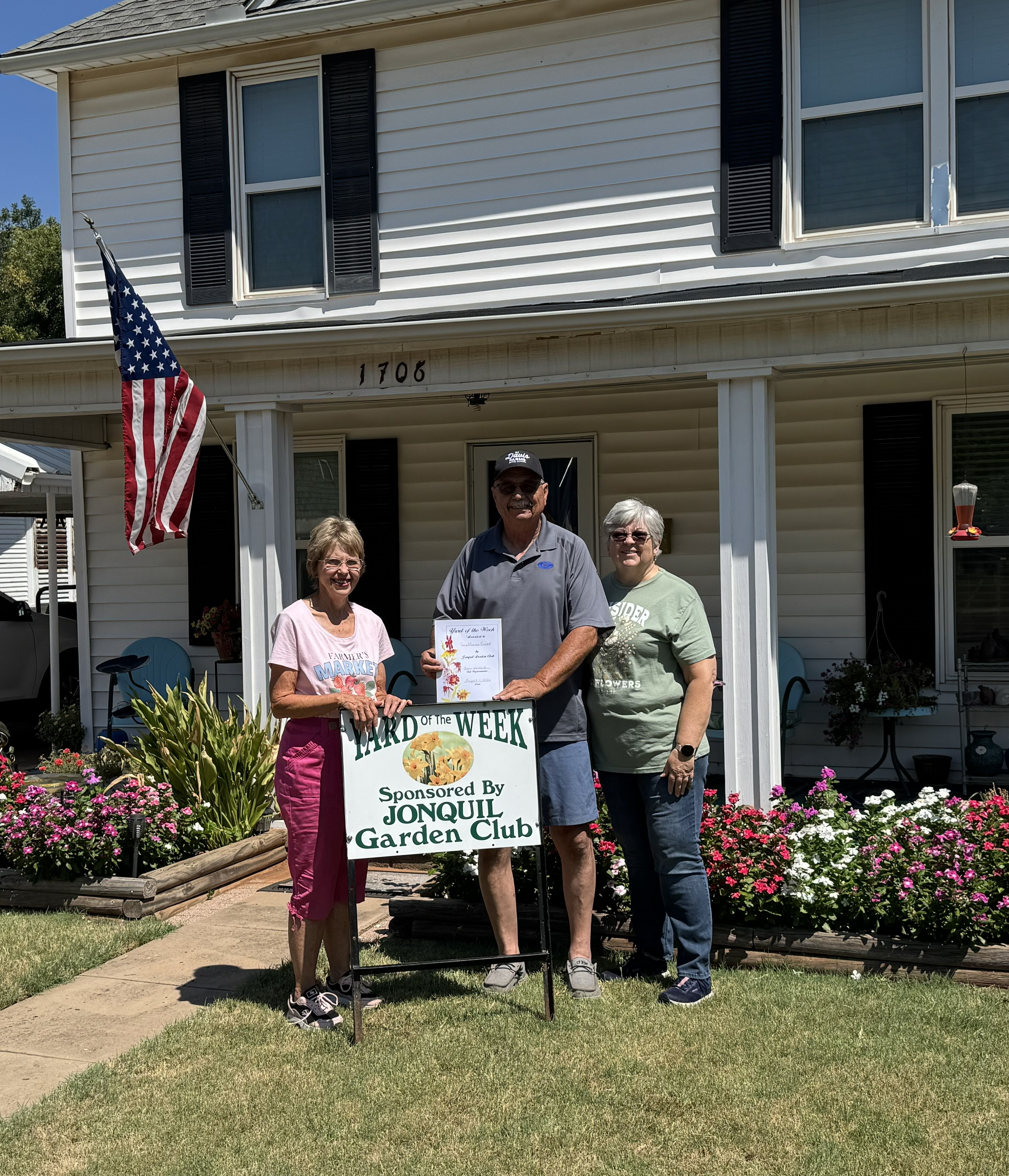 Jonquil Garden Club is pleased to announce their Yard of the week to the Poupards at 1706 West Cleveland. Pictured is Brenda Nivens, Jonquil Garden Club member and Gary and Ramona Poupard.