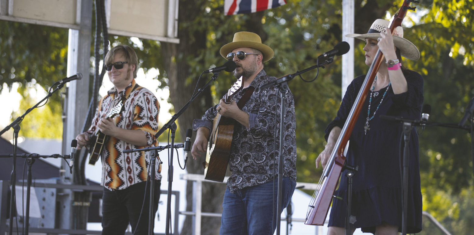 Rick Faris, center, performs with his band Friday on the Byron Berline Main Stage at Oklahoma’s International Bluegrass Festival in Guthrie. Faris, who first played the festival in 2010, credited the late Byron Berline’s friendships with musicians around the world for the festival’s international lineup. “It’s a legendary festival, but also the fun that we have in the campground with jamming and hanging out with friends,” Faris said. Photo by Brent Fuchs