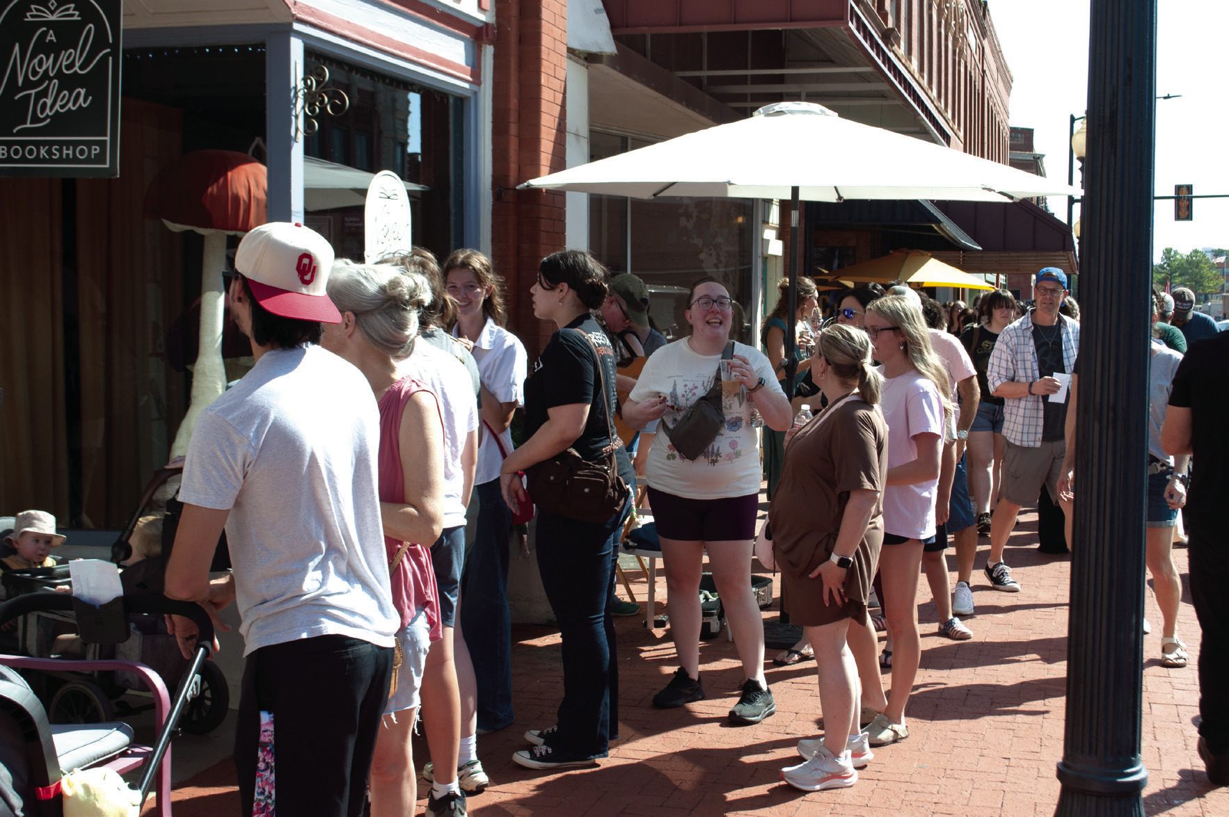 Fans of Gilmore Girls line up outside A Novel Idea Bookshop during Guthrie’s Stars Hollow Fall Celebration, which brought an estimated 2,000 visitors to downtown. Photo by Nikki Bos